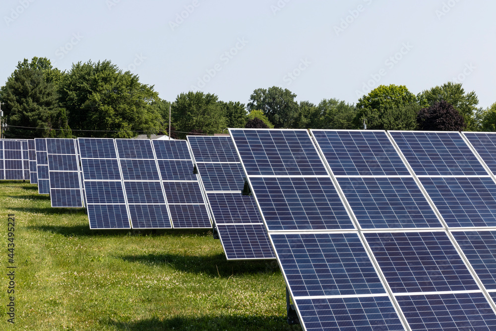 Solar Thermal Flat Panels in a residential neighborhood. Residents are installing renewable energy sources to reduce their carbon footprint. Solar Thermal Flat Panels in a residential neighborhood. Residents are installing renewable energy sources to reduce their carbon footprint.