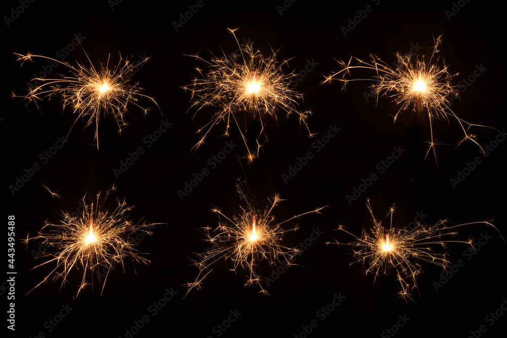 Several Christmas sparklers on black background