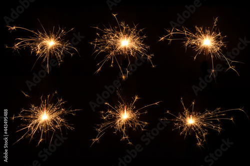 Several Christmas sparklers on black background