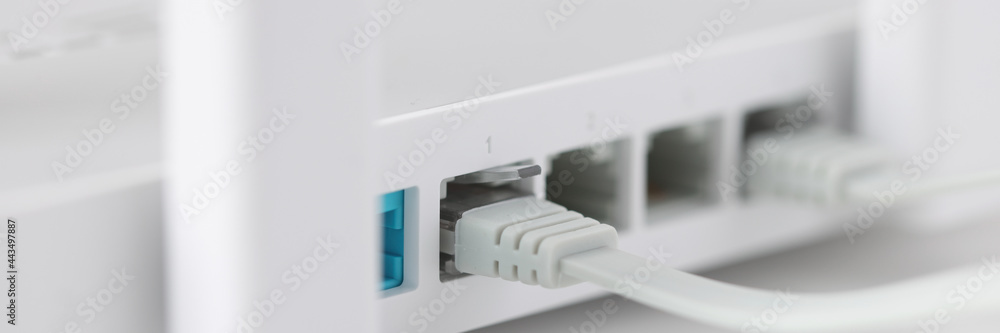 Network cable is plugged into socket of access point closeup Network cable is plugged into socket of access point closeup