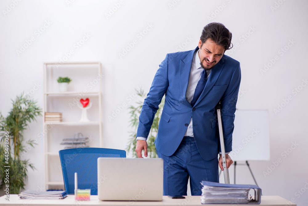 Young male employee after accident at workplace Young male employee after accident at workplace