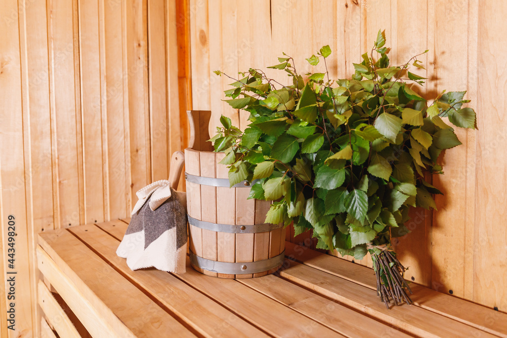 Traditional old Russian bathhouse SPA Concept. Interior details Finnish  sauna steam room with traditional sauna accessories basin birch broom scoop  felt. Relax country village bath concept Stock Photo | Adobe Stock