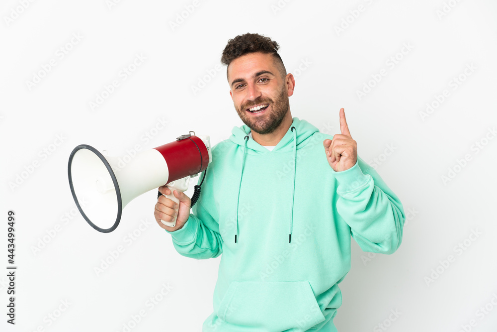 Caucasian man isolated on white background holding a megaphone and pointing up a great idea Caucasian man isolated on white background holding a megaphone and pointing up a great idea