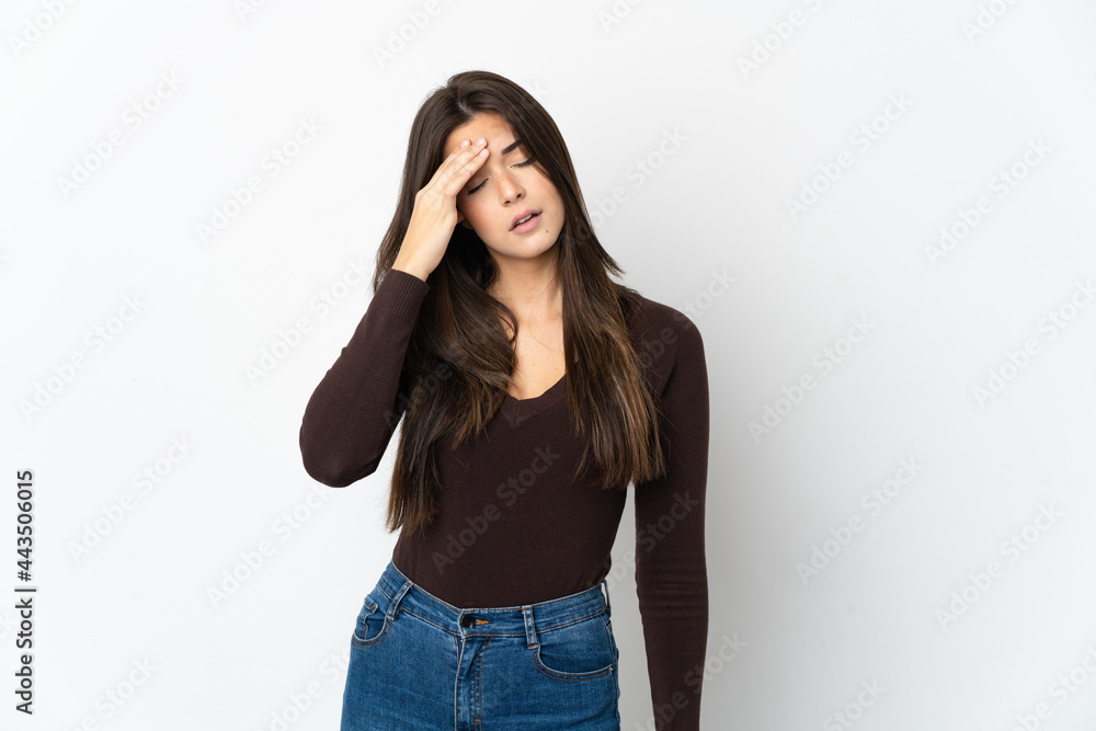 Teenager Brazilian girl isolated on white background with headache Teenager Brazilian girl isolated on white background with headache