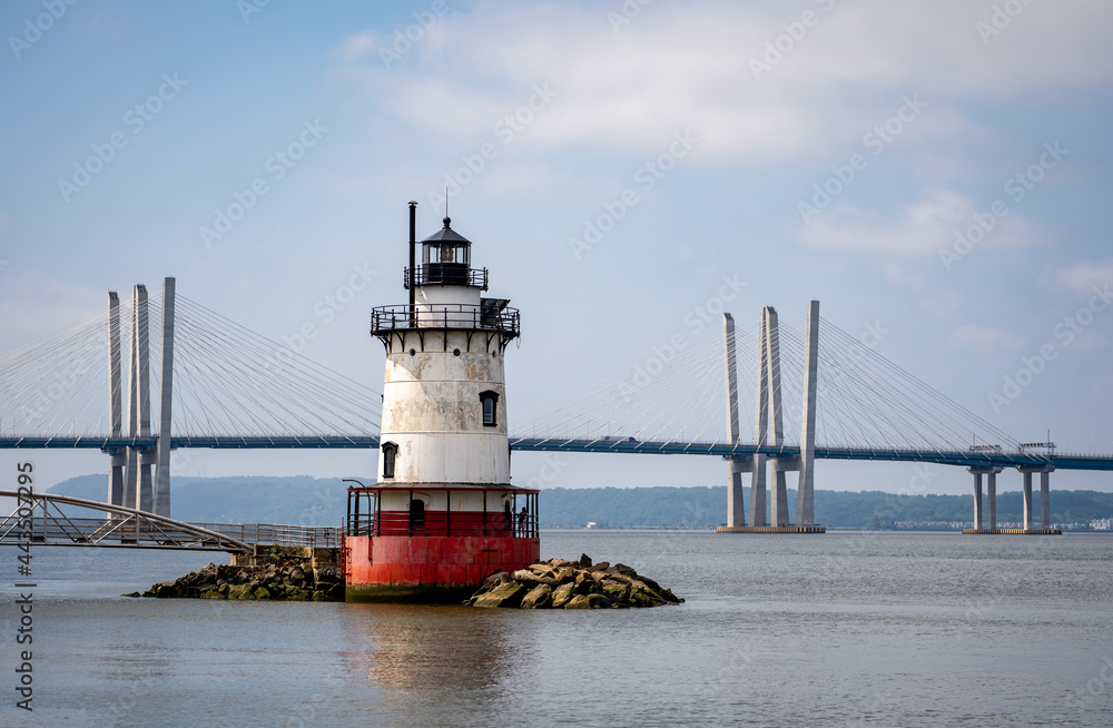 Sleepy Hollow, NY - USA - July 5, 2021: a horizontal view of the scenic Tarrytown Light with the Governor Mario M. Cuomo Bridge behind  it.