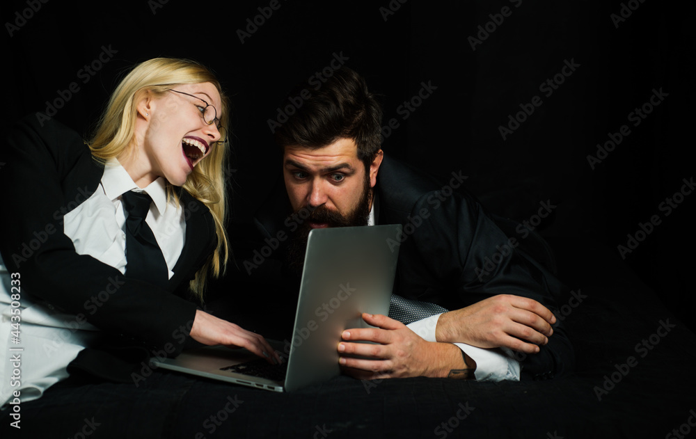 Business couple of stylish hipster guys and businesswoman discuss about new company project, using computer. Business couple of stylish hipster guys and businesswoman discuss about new company project, using computer.