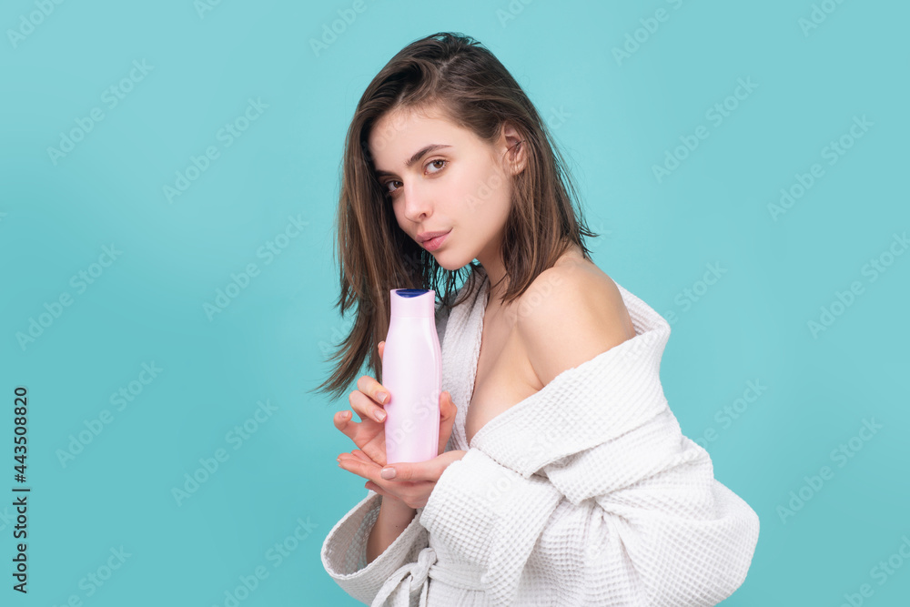 Health hair and beauty concept. Woman hold bottle shampoo and conditioner. Young woman advertising care product. Health hair and beauty concept. Woman hold bottle shampoo and conditioner. Young woman advertising care product.