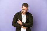 Young handsome caucasian man isolated on purple background smiling a lot