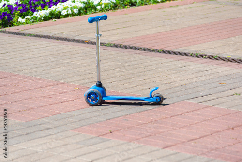 A scooter left in the park.