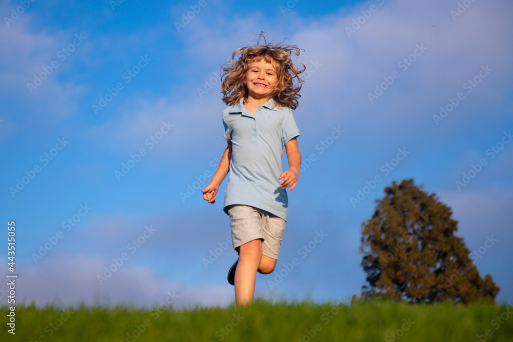Child run in park outdoor. Spring kid walk on grass. Summer boy. Children carefree. Child run in park outdoor. Spring kid walk on grass. Summer boy. Children carefree.