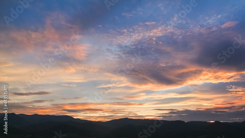 Colorful Sunset sky in mountains with clouds, Horizon. Warm Colours. © AungMyo