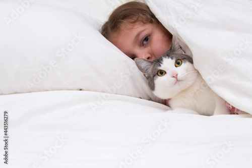 teen girl hug cat in bed, Girl and her Pet Cat
