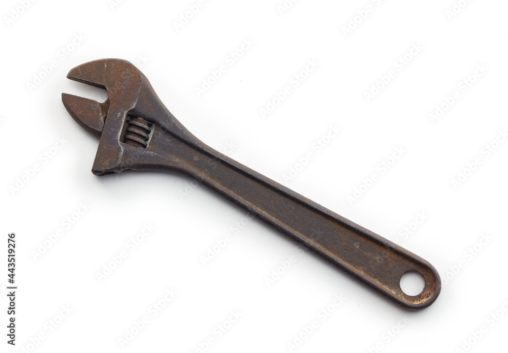Adjustable wrench or crescent wrench isolated on white. Old and rusted Vintage open ended wrench in real life condition. Adjustable wrench or crescent wrench isolated on white. Old and rusted Vintage open ended wrench in real life condition.