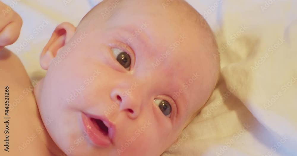 little funny baby with pink pacifier in his mouth. close-up portrait. little funny baby with pink pacifier in his mouth. close-up portrait.