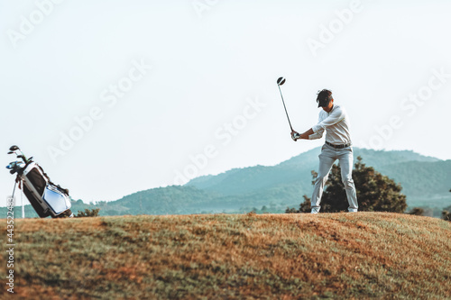 Golfers on starting point with beautiful swing.