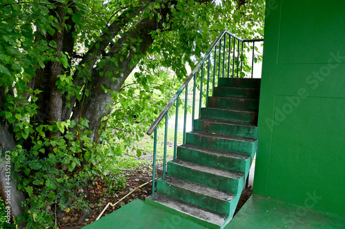 The Green cement stairs with green steel handrails for going upstairs.