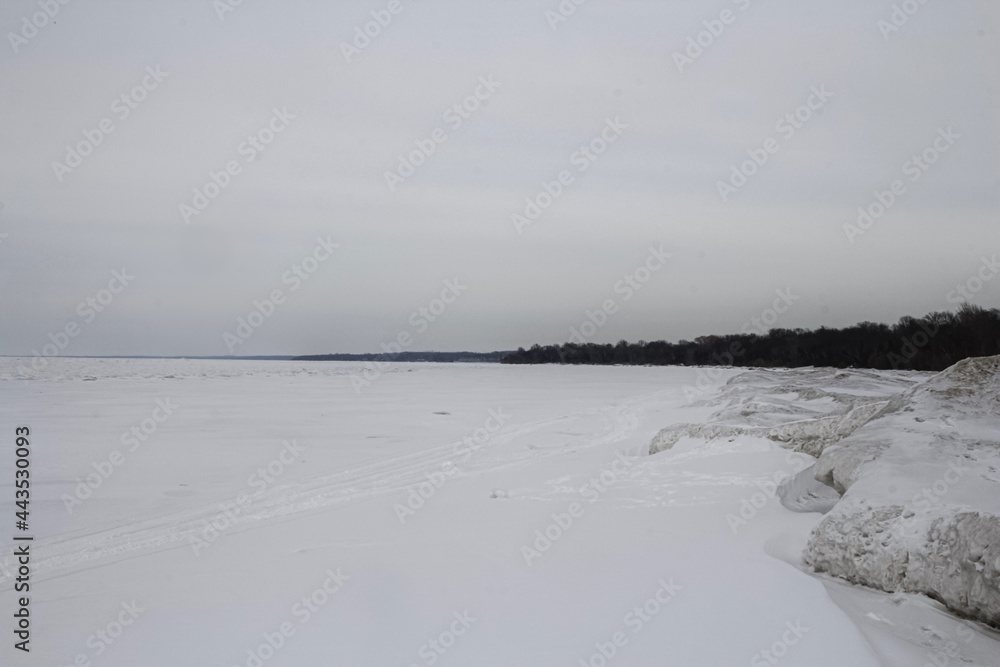 Frozen lake covered by snow like white desert