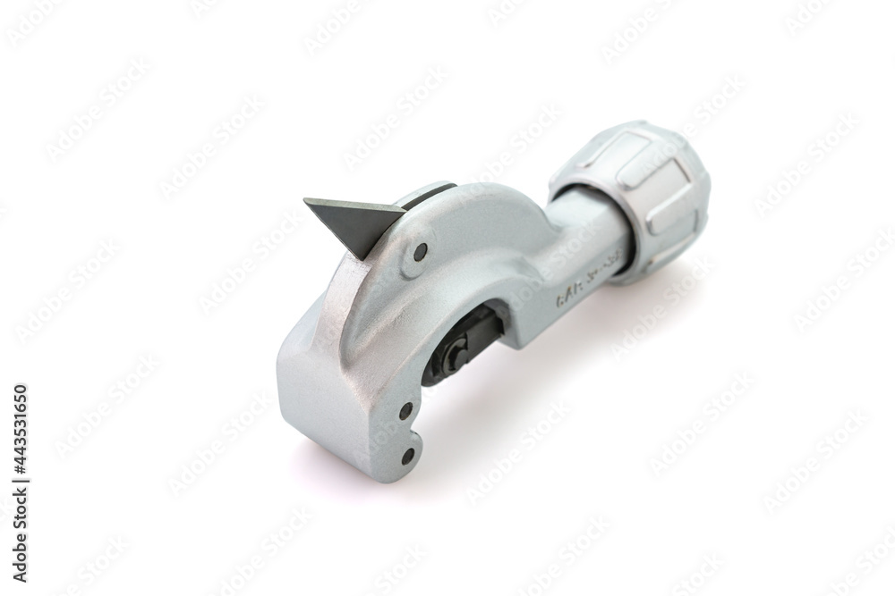 Metal pipe cutter for copper and aluminum isolated on white background. Selective focus. Metal pipe cutter for copper and aluminum isolated on white background. Selective focus.