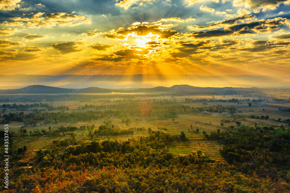 Sunset / sunrise with clouds, light rays and other atmospheric effect