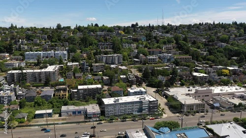 Cinematic 4K aerial drone pan footage of Southeast Magnolia, Interbay, Lawton Park and West Queen Anne, upscale, affluent neighborhoods uptown by Puget Sound, in Seattle, Washington photo