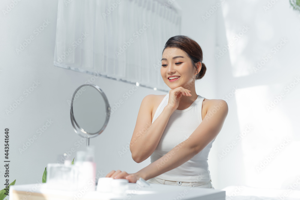 Face of young beautiful healthy woman looking in the mirror Face of young beautiful healthy woman looking in the mirror