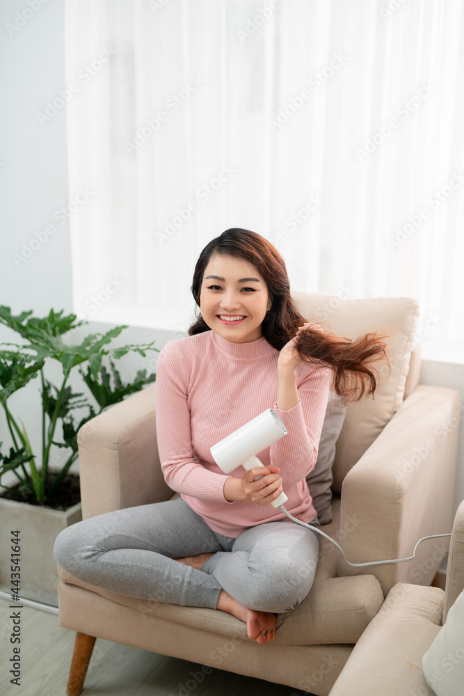 Portrait of beautiful woman, she holding hair dryer Portrait of beautiful woman, she holding hair dryer
