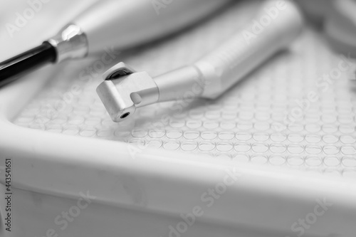 Close-up teeth airflow tool on dental table photo