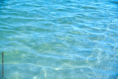 Transparent calm sea surface on a sunny day.