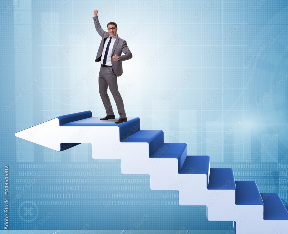 Businessman climbing career ladder in business concept Businessman climbing career ladder in business concept