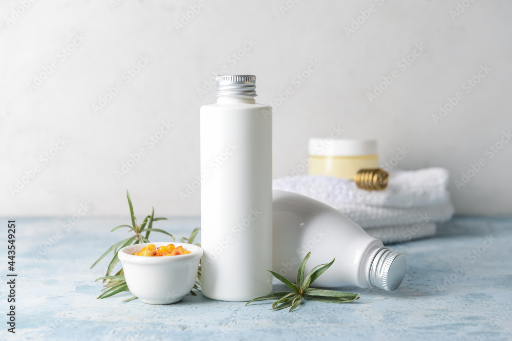Healthy sea buckthorn cosmetics on table Healthy sea buckthorn cosmetics on table
