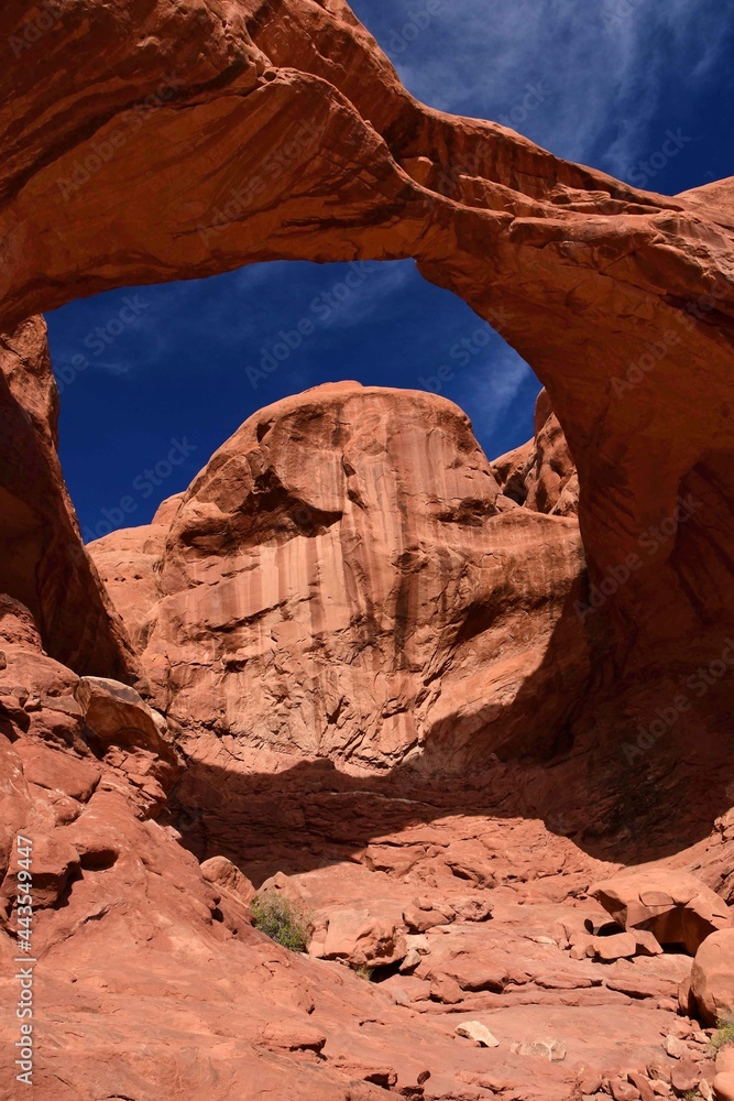 scenic double arch rock formation on a sunny day, in arches national park, utah