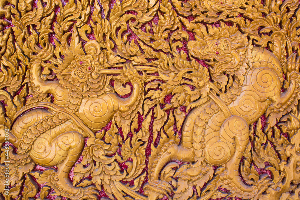 Fototapeta premium Carved lion Thai style art on door