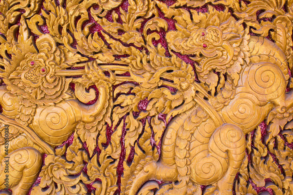 Carved lion Thai style art on door