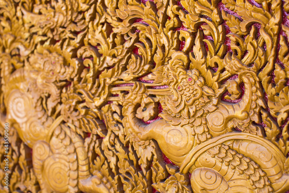 Fototapeta premium Carved lion Thai style art on door