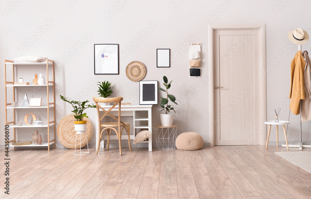 Interior of stylish room with modern workplace and pictures Interior of stylish room with modern workplace and pictures