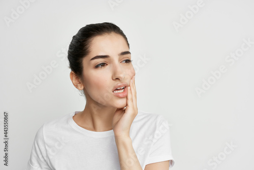 woman with aching tooth health problems dissatisfaction isolated background
