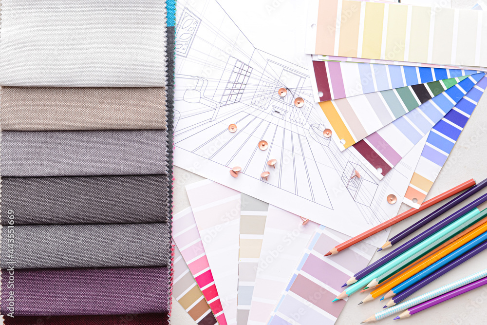 Composition with paint color palettes and fabric samples on white background Composition with paint color palettes and fabric samples on white background