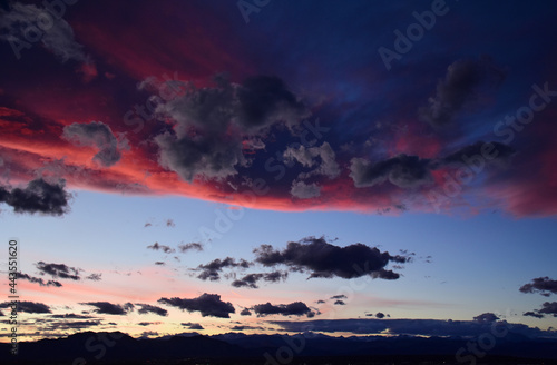 a colorful sunset of interesting contrasts and textures  over the front range of the colorado rocky mountains  as seen from Broomfield  colorado 