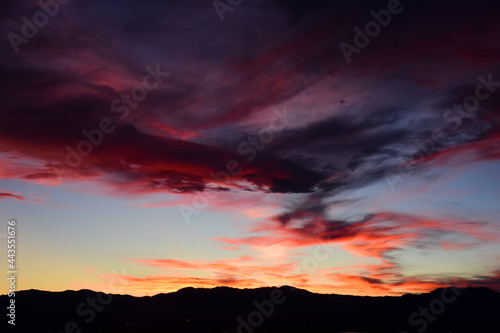 Multi-colored sunset over the front range of the rocky mountains of colorado. as seen from broomfield, colorado © Nina