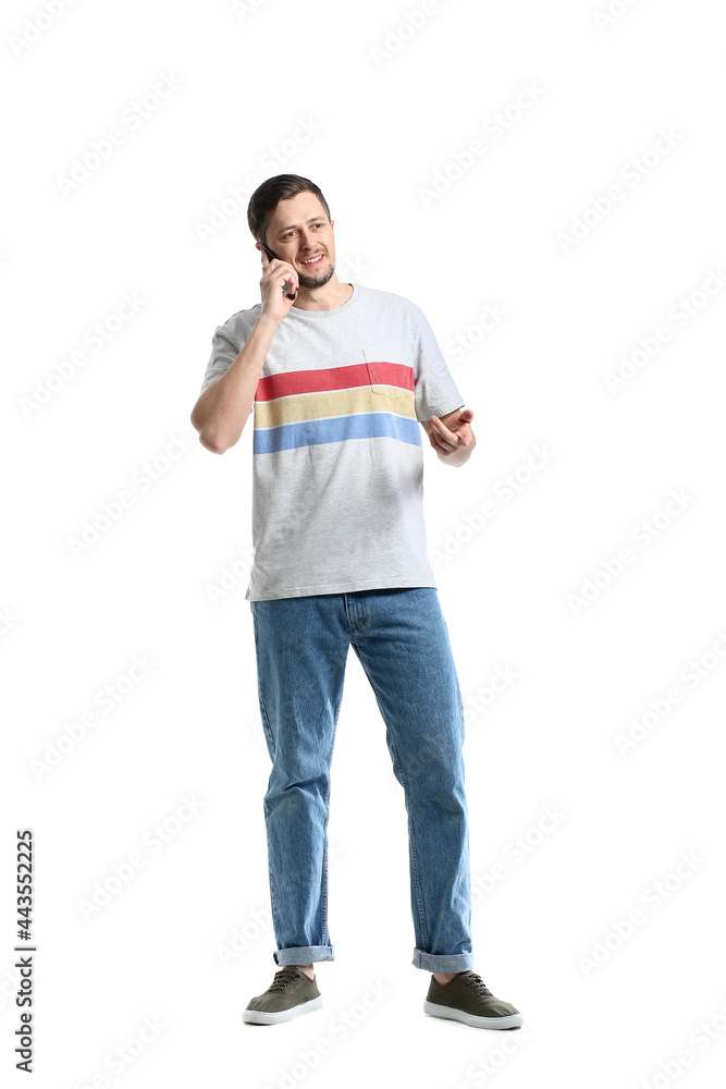 Handsome man talking by mobile phone on white background Handsome man talking by mobile phone on white background