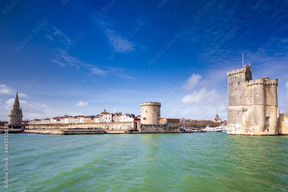 Entrance of the old harbor of La Rochelle in France, with the Tour de la Chaine, the Tour Saint-Nicolas and Tour de la Lantern, Nouvelle Aquitaine region, department of Charente-Maritime, France.