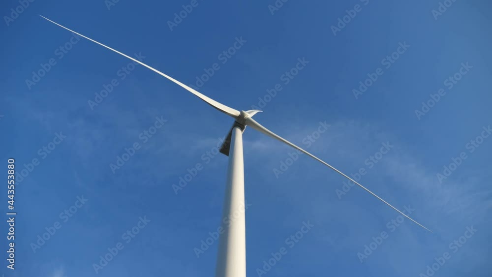 Electrical windmill rotating and collecting wind energy with its propeller Electrical windmill rotating and collecting wind energy with its propeller