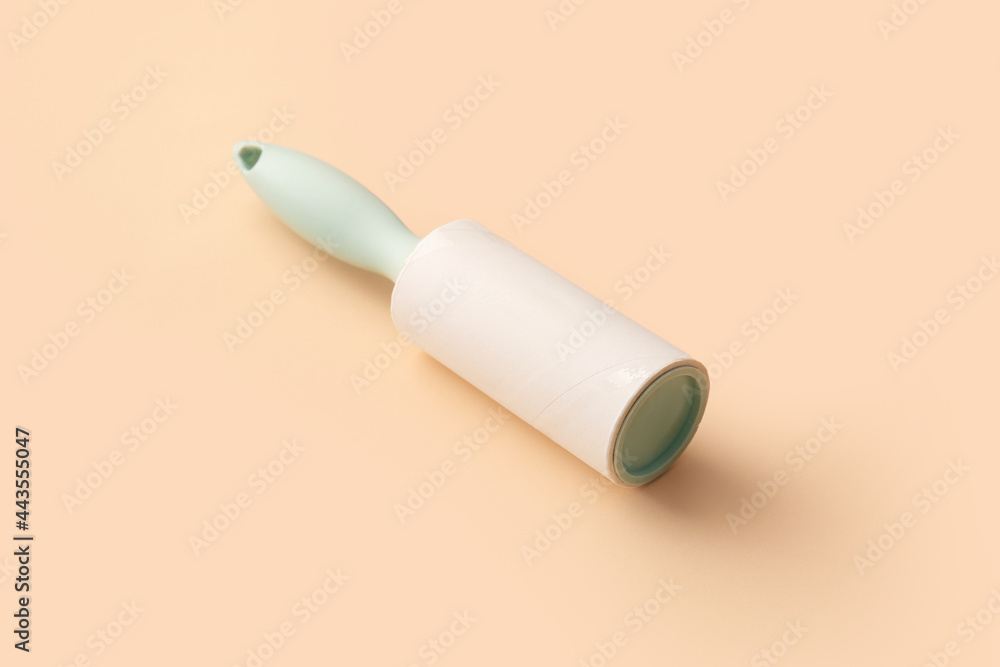 Lint roller on color background Lint roller on color background