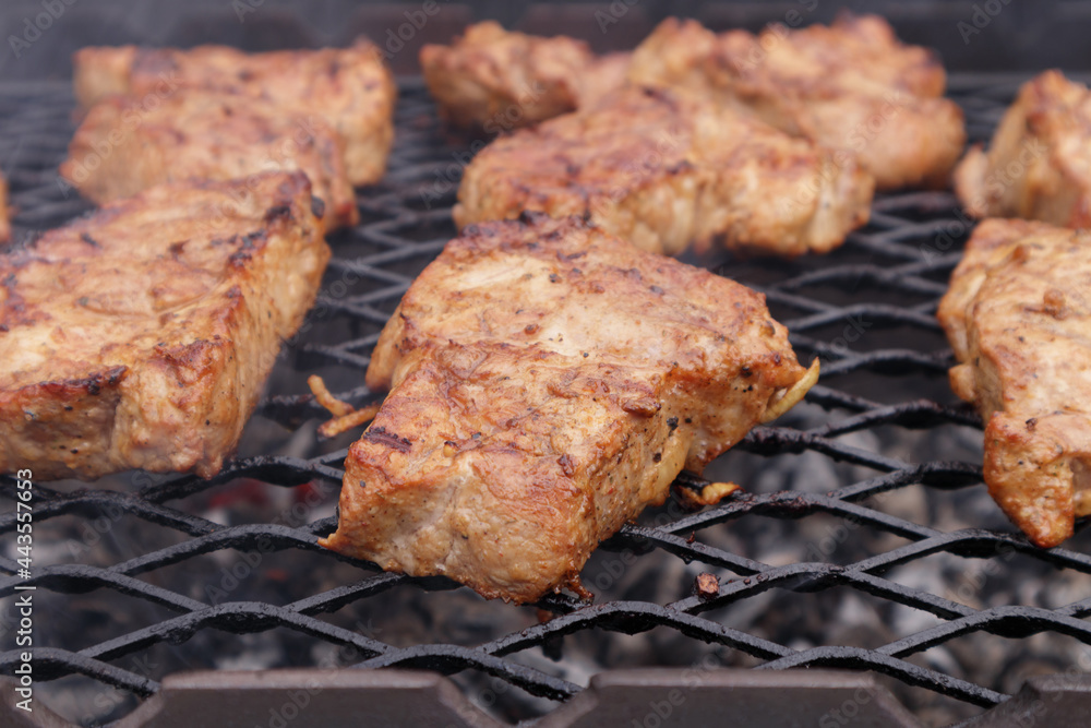 Pork neck chop steaks were baked on a barbecue grill