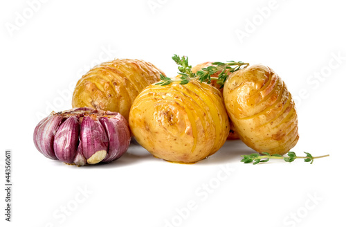 Baked potato with garlic and herbs on white background
