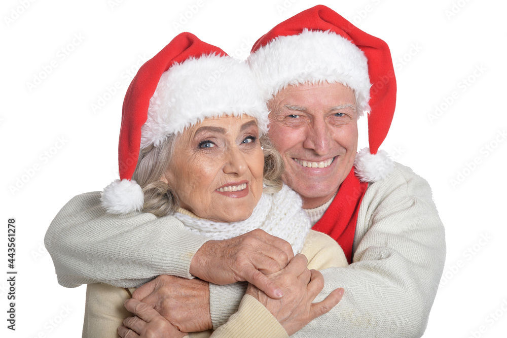 Portrait of happy senior couple in Santa hats Portrait of happy senior couple in Santa hats