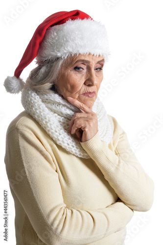 Portrait of sad senior woman in Santa hat