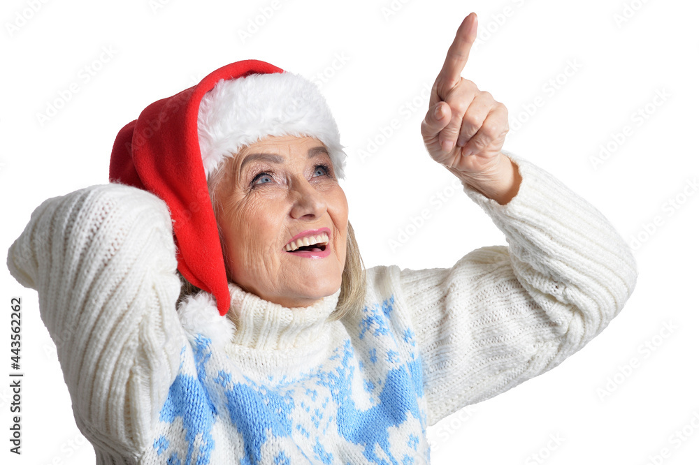 Portrait of smiling happy senior woman in Santa hat posing Portrait of smiling happy senior woman in Santa hat posing