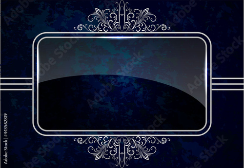 Decorative silver frame with an openwork pattern on a dark background.