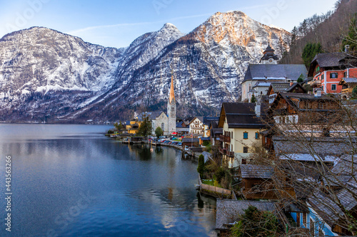 View of the famous Hallstatt town at the lake with mountain ranges in background
